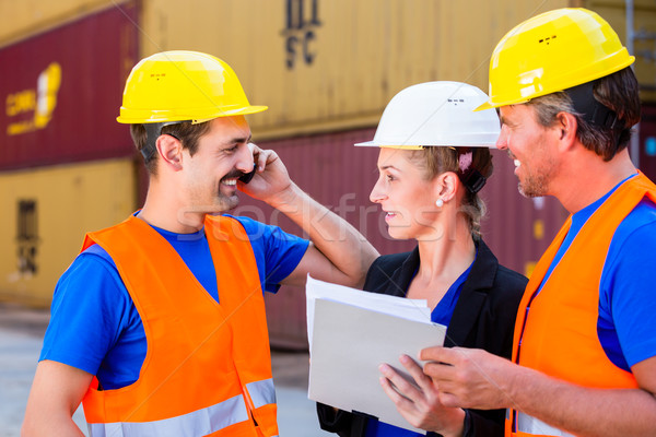 Worker and manager of shipment company discussing Stock photo © Kzenon