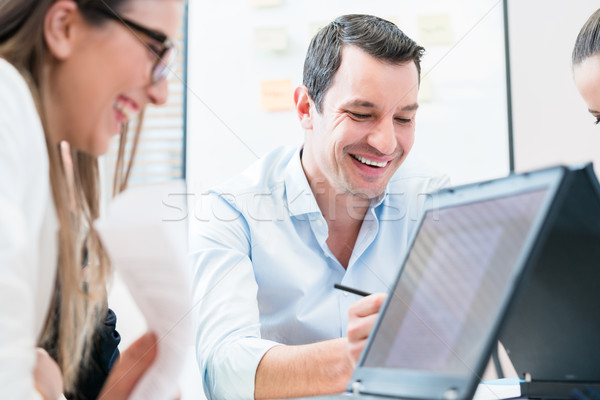 Team in office having meeting Stock photo © Kzenon