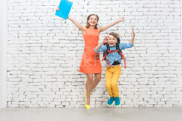 Student or pupil and teacher being excited about school  Stock photo © Kzenon