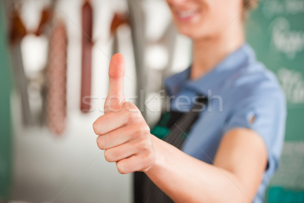 Vrouwelijke slager tonen teken Stockfoto © Kzenon
