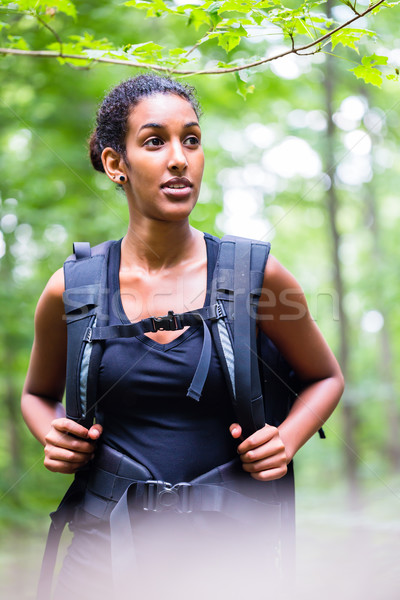 African young woman hiking on forest track  Stock photo © Kzenon