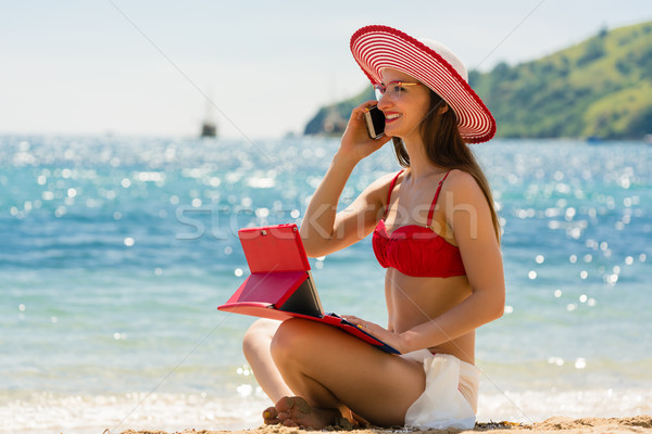 Fashionable young woman on the beach Stock photo © Kzenon