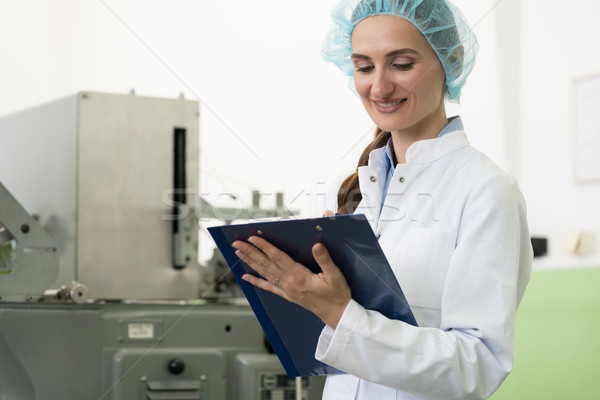 Portrait of woman inspector during quality control in factory Stock photo © Kzenon