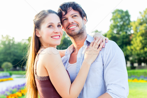 Tourist couple in city park hugging in love Stock photo © Kzenon