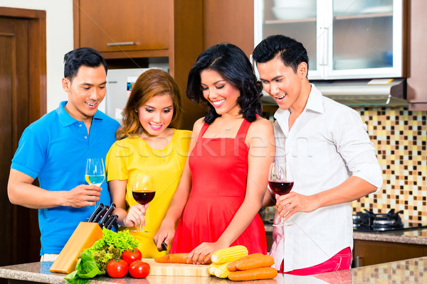 Asian friends cooking  for dinner party Stock photo © Kzenon