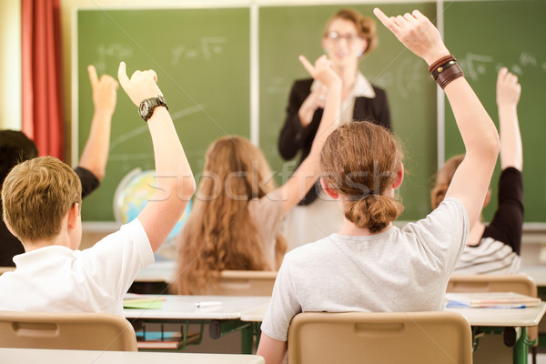 Teacher  in a class of  pupils in school Stock photo © Kzenon