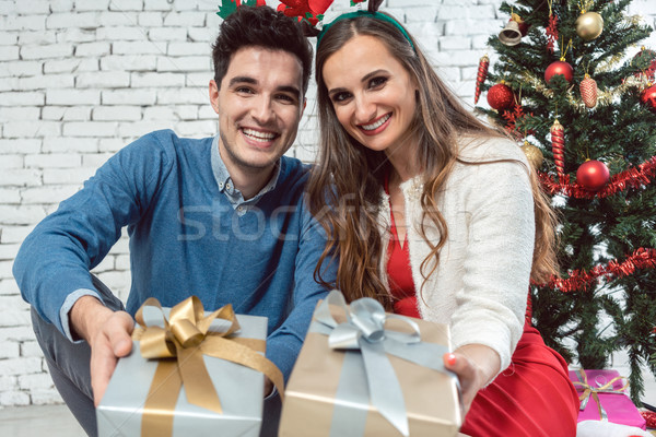 Couple with Christmas presents in silver and gold Stock photo © Kzenon