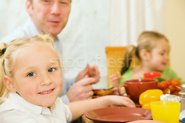 Stock photo: Family having breakfast