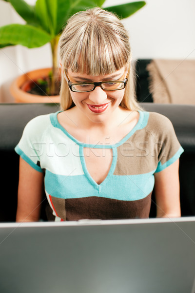 Female telecommuter and sofa business Stock photo © Kzenon