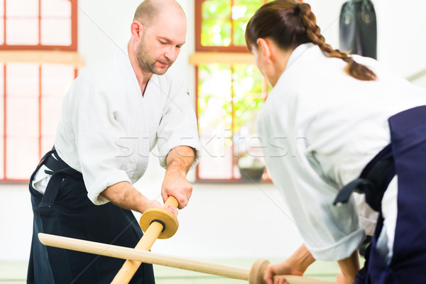Man vrouw aikido zwaard strijd vechten Stockfoto © Kzenon