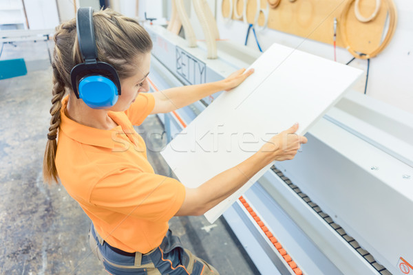 Woman carpenter working in furniture factory Stock photo © Kzenon