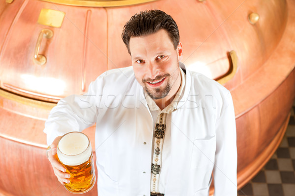 brewer with beer glass in brewery Stock photo © Kzenon