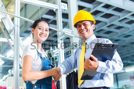 Production manager and designer in Asian factory Stock photo © Kzenon