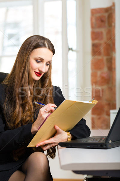woman in office sitting on the computer Stock photo © Kzenon