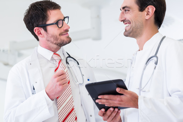 Doctors discussing images of x-ray scan in CT Stock photo © Kzenon