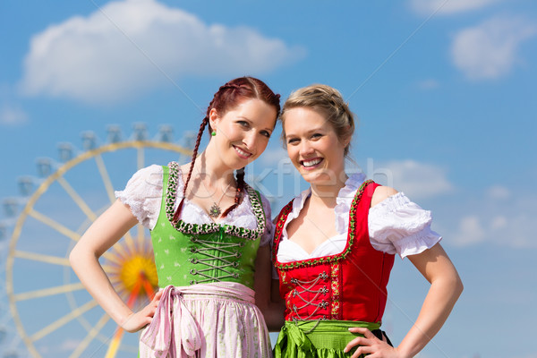 Women in traditional Bavarian clothes or dirndl on festival Stock photo © Kzenon