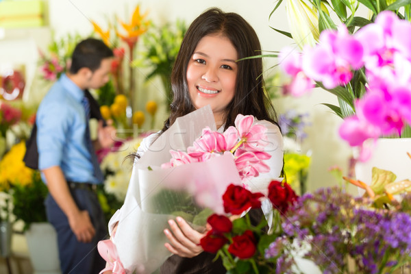 Saleswoman and customer in flower shop Stock photo © Kzenon