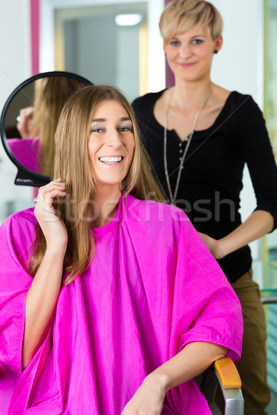 Woman at the hairdresser getting advise Stock photo © Kzenon