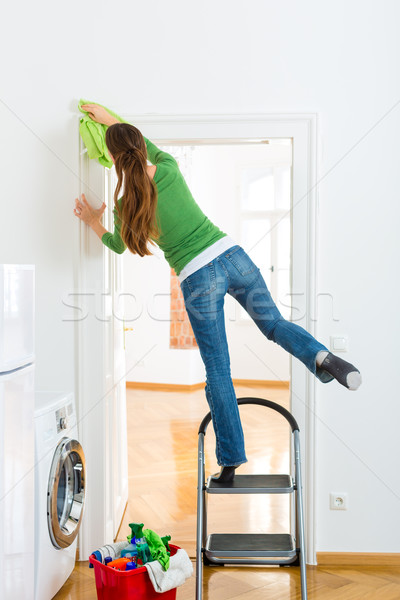 Woman at the spring cleaning working dangerously Stock photo © Kzenon