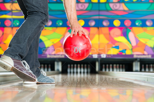 Young man bowling having fun Stock photo © Kzenon