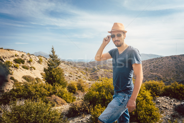 Man tourist in front of southern European landscape Stock photo © Kzenon