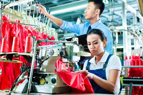Seamstress and shift supervisor in textile factory Stock photo © Kzenon