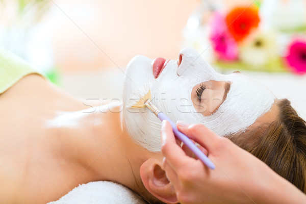 Wellness - woman getting face mask in spa Stock photo © Kzenon
