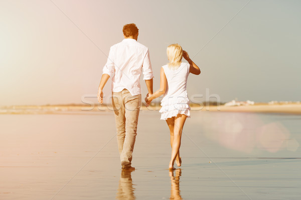 Couple on the beach in summer vacation Stock photo © Kzenon