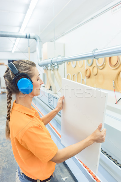 Woman carpenter working in furniture factory Stock photo © Kzenon