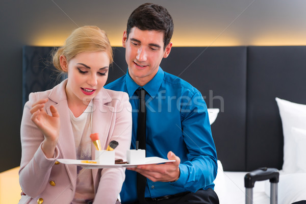 Man and woman arriving in hotel room Stock photo © Kzenon
