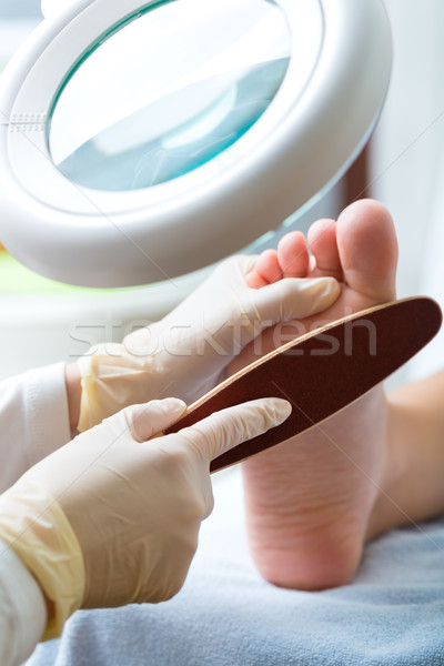 Woman receiving podiatry treatment in Day Spa Stock photo © Kzenon