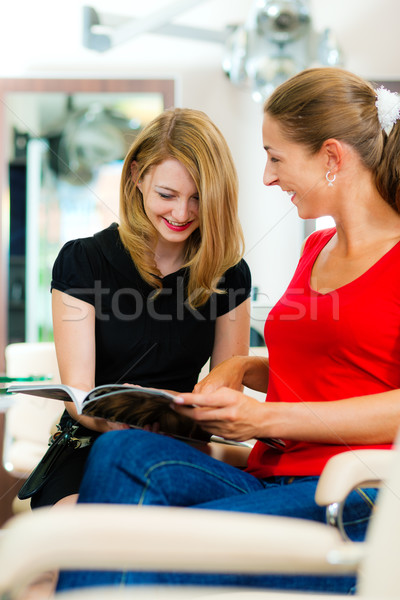 Woman at the hairdresser getting advise Stock photo © Kzenon