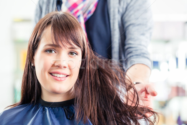 Hairdresser blow dry woman hair in shop Stock photo © Kzenon