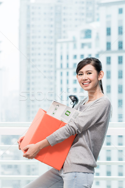 Young asian girl carrying removal crate Stock photo © Kzenon