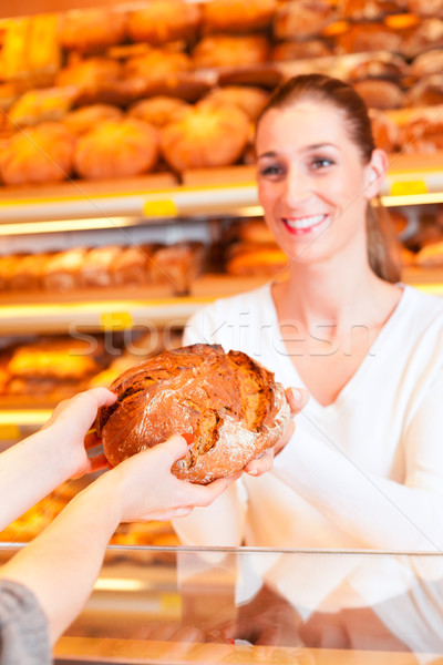Salesperson with female customer in bakery Stock photo © Kzenon