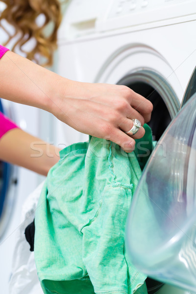 Female student in a laundry Stock photo © Kzenon