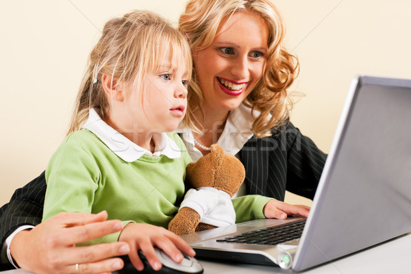 Businesswoman and mother showing kid the internet Stock photo © Kzenon