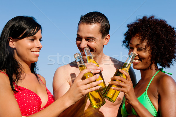 Group of friends drinking beer in swimwear Stock photo © Kzenon