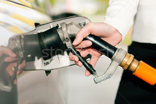 Nő megtankol autó benzin kéz benzinkút Stock fotó © Kzenon