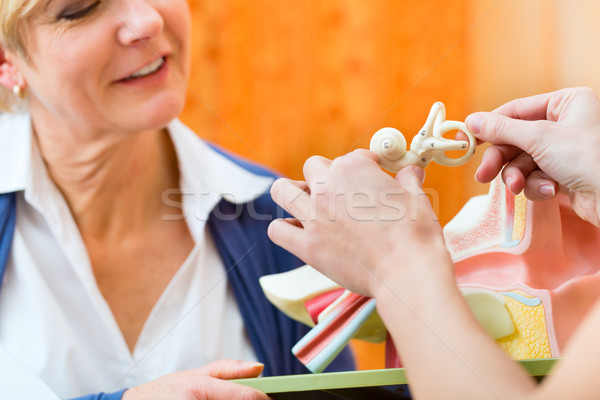 Stock photo: Deaf woman makes a hearing test