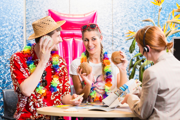 Man and woman booking holiday trip Stock photo © Kzenon