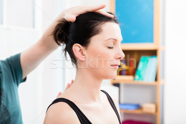 Woman having head massage from physiotherapist Stock photo © Kzenon