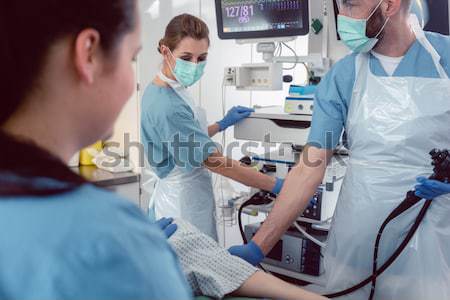 Internist doctors during stomach examination  Stock photo © Kzenon