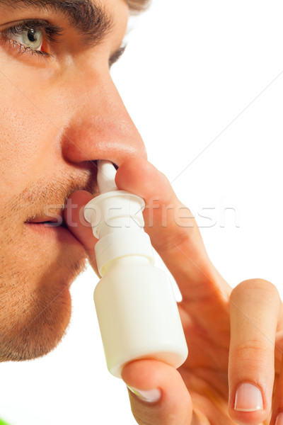 Young man with nasal spray Stock photo © Kzenon