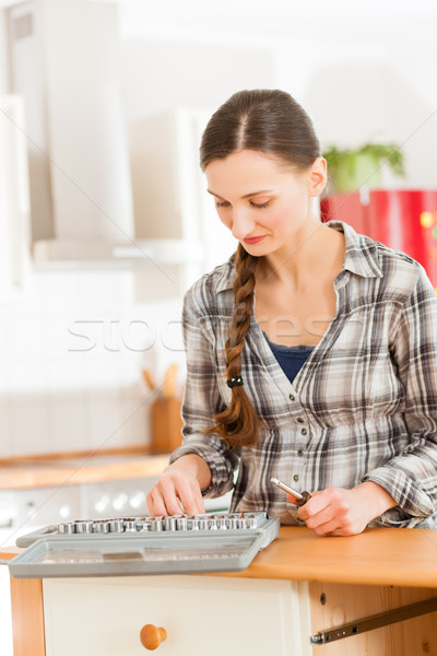 Woman with toolbox and screwdriver Stock photo © Kzenon