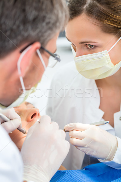 Paciente dentista dental tratamento feminino assistente Foto stock © Kzenon