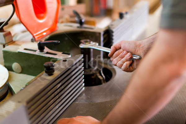 Stock photo: Carpenter adjust cutter