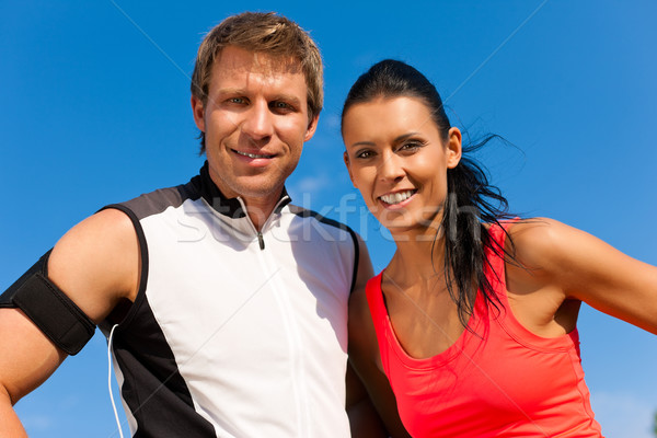Young couple is doing sports outdoors Stock photo © Kzenon