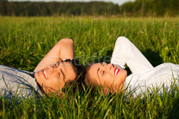 Couple sleeping on meadow in the sunshine Stock photo © Kzenon