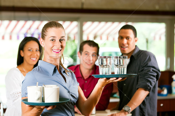 Woman as waitress in a bar or restaurant Stock photo © Kzenon